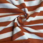 Orange and brown striped looped terry knit fabric