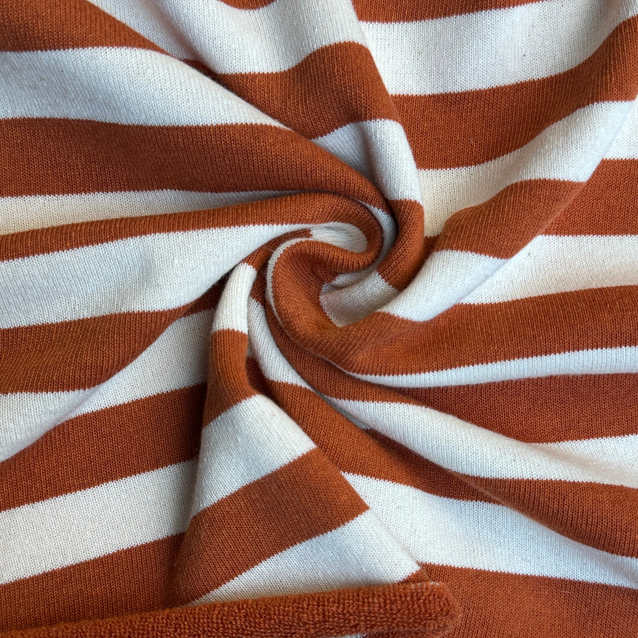 Orange and brown striped looped terry knit fabric