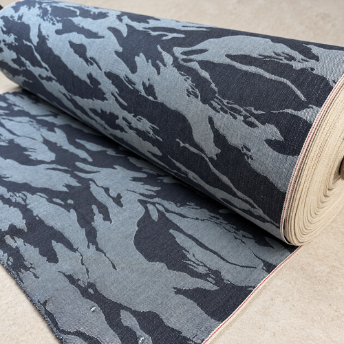 Styled product photograph of Camo Japanese Selvedge Denim | 32"-40" Wide. Original fabric photos follow.