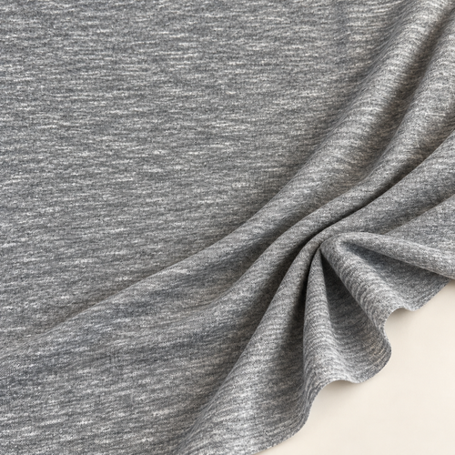 Styled product photograph of Nep Slub Knit Fabric, Gray, 90% Cotton 10% Polyester 100 GSM, Textured Lightweight Apparel Fabric, Sold by the Yard; original photographs follow.