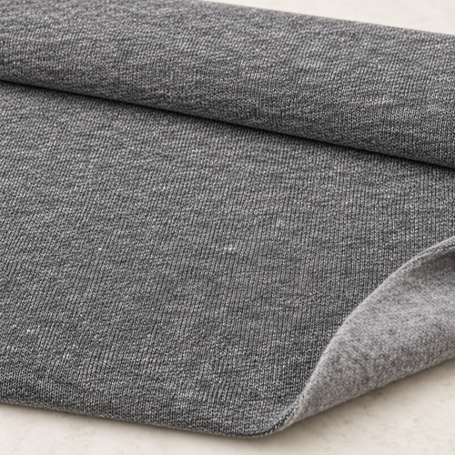 Styled product photograph of Heather Gray Cotton Fleece Fabric, 90% Cotton 10% Polyester, Sweatshirt Fleece Hoodie Fabric, Sold by the Yard. Original fabric photos follow.