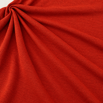Styled product photograph of Orange Red Polyester Knit Fabric, 100% Polyester Solid Stretch, Activewear Legging Fabric, Sold by the Yard; original photographs follow.