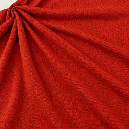 Styled product photograph of Orange Red Polyester Knit Fabric, 100% Polyester Solid Stretch, Activewear Legging Fabric, Sold by the Yard; original photographs follow.