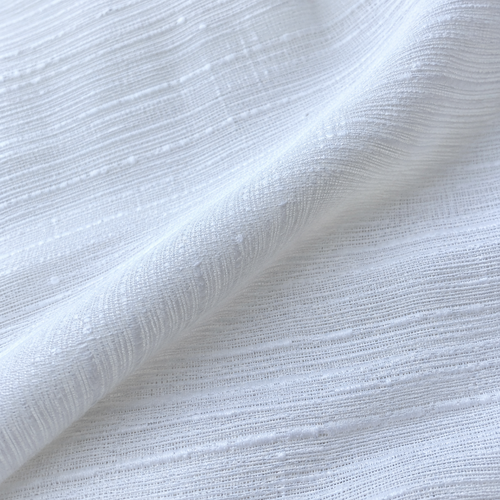 Styled product photograph of 58" PFD White 100% Lyocell Tencel Blend Ripstop Woven Fabric; original photographs follow.