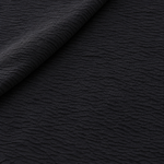 Styled product photograph of 60" 100% Lyocell Black Ghost Wrinkly Woven Fabric By the Yard; original photographs follow.