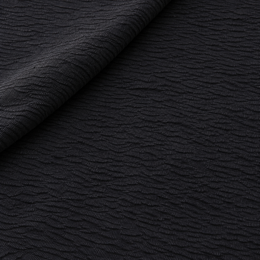 Styled product photograph of 60" 100% Lyocell Black Ghost Wrinkly Woven Fabric By the Yard; original photographs follow.
