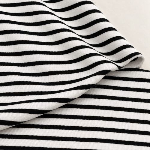Striped Cotton Jersey Knit Fabric, Black and Cream Stripe, 85% Cotton 10% Spandex 5% Polyester 309 GSM, Soft Drapey Apparel Fabric, Sold by the Yard — styled fabric photograph