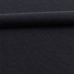 Black — enzyme-washed Tencel Lyocell Gabardine — styled fabric photograph