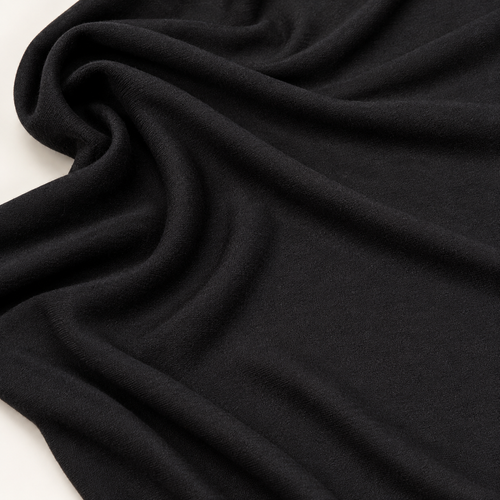 65" Modal Spandex Stretch Blend Piece Dyed Black Knit Fabric — styled fabric photograph
