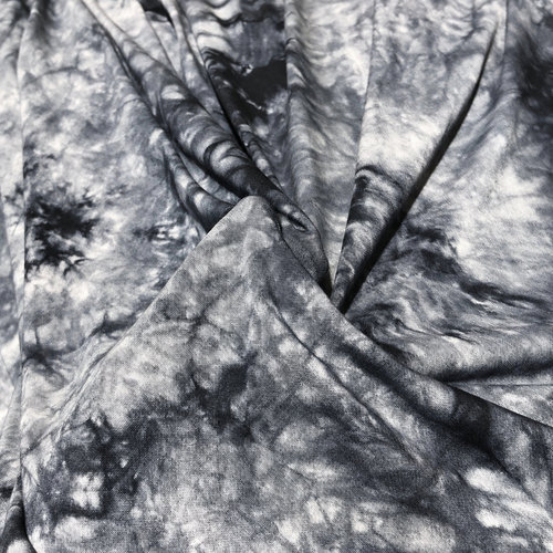 60" Bamboo Spandex Lycra Tie Dyed Black & White Cloud Knit Fabric — styled fabric photograph