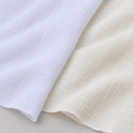 56" Off White Ivory & White 100% Cotton Gauze Wrinkly Woven Fabric — both color options, styled fabric photograph