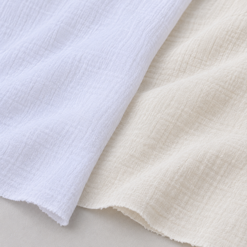 56" Off White Ivory & White 100% Cotton Gauze Wrinkly Woven Fabric — both color options, styled fabric photograph