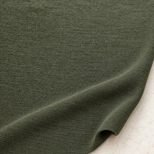 Dark Green Stretch Knit Fabric, 100% Polyester Solid, Leggings Activewear Apparel Fabric, Sold by the Yard — styled fabric photograph