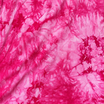 Hot Pink bamboo spandex tie-dye jersey knit fabric, styled close-up