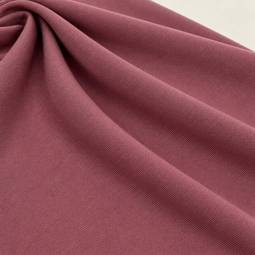 Mauve Dusty Pink Stretch Knit Fabric, 100% Polyester Solid, Leggings Activewear Apparel Fabric, Sold by the Yard — styled fabric photograph