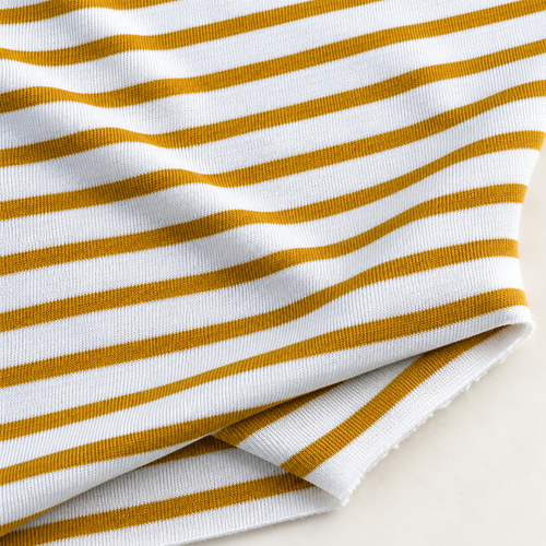 Striped Cotton Jersey Knit Fabric, Yellow and White Stripe, 80% Cotton 20% Polyester 216 GSM, Soft Drapey Apparel Fabric, Sold by the Yard — styled fabric photograph