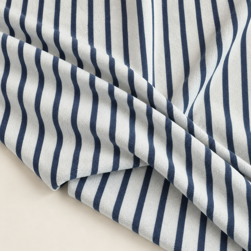 Striped Cotton Jersey Knit Fabric, Sky Blue and White Stripe, 100% Cotton 200 GSM, Soft Drapey Apparel Fabric, Sold by the Yard — styled fabric photograph
