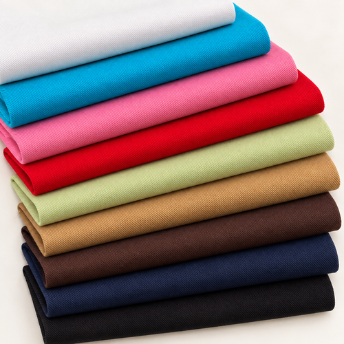 pima-cotton-stretch-twill-nine-color-fan fabric showing the full color range in a styled arrangement