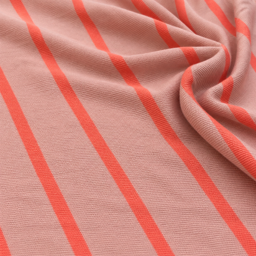 62" Pink Orange Striped 100% Polyester Knit Fabric By the Yard — styled fabric photograph