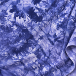 Purple bamboo spandex tie-dye jersey knit fabric, styled close-up