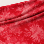 Red bamboo spandex tie-dye jersey knit fabric, styled product photo