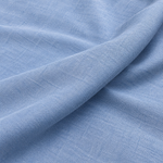 Sky Blue (6 OZ) — enzyme-washed Tencel Lyocell Gabardine — styled fabric photograph