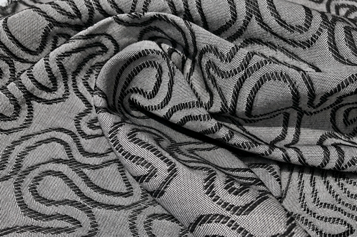 60" Embroidered Swirl Jacquard Cotton Black & Gray Woven Fabric By — styled fabric photograph