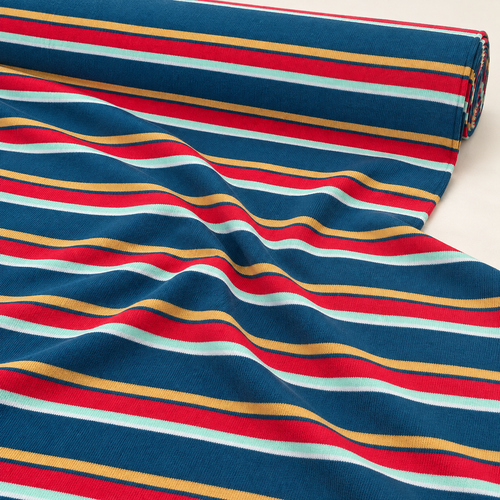 Striped Cotton Jersey Knit Fabric, Blue and Yellow and Red Stripe, 40% Cotton 60% Polyester 154 GSM, Soft Drapey Apparel Fabric, Sold by the Yard — styled fabric photograph