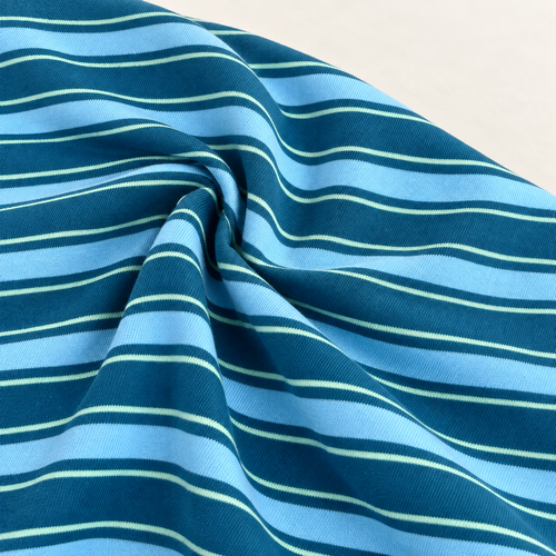 Striped Cotton Jersey Knit Fabric, Blue and Light Gray Stripe, 48% Cotton 50% Polyester 2% Spandex 149 GSM, Soft Drapey Apparel Fabric, Sold by the Yard — styled fabric photograph