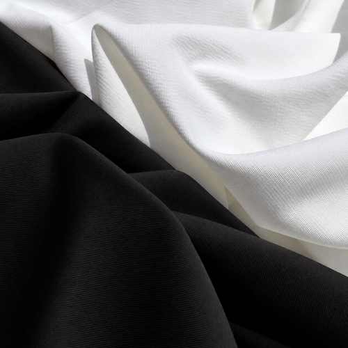 58" 100% Lyocell Tencel Bengaline Faille Optic White or Black Woven — both color options, styled fabric photograph