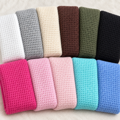 waffle-thermal-eleven-color-arched-folds fabric showing the full color range in a styled arrangement