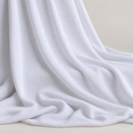 62" White Polyester Spandex Jersey Knit Fabric By the Yard — styled fabric photograph
