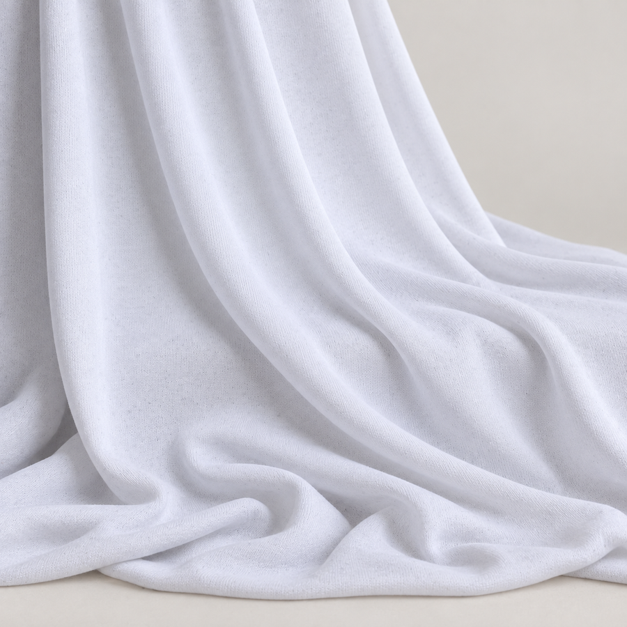 62" White Polyester Spandex Jersey Knit Fabric By the Yard — styled fabric photograph